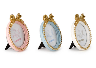 Pink, blue, and white round photo frames with gold bows

Gold beaded round photo frames with bow detail

Assorted pastel round frames with gold bow top

Elegant nursery photo frames with gold trim and bow