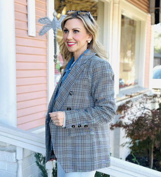Woman wearing a gray plaid double-breasted blazer with denim shirt insert detail

Darlene Double Blazer in plaid with double-breasted buttons and denim collar detail

Plaid blazer with denim shirt insert, double-breasted front, and long sleeves

Structured plaid blazer layered with built-in denim shirt insert