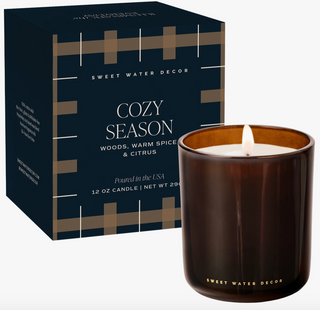 Cozy Season 12 oz boxed soy candle in an amber glass jar with notes of woods, warm spice, and citrus.