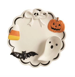 Ceramic Halloween chip and dip server featuring hand-painted candy corn, pumpkin, ghost, skull, and bat accents with an attached ghost-shaped dip bowl.