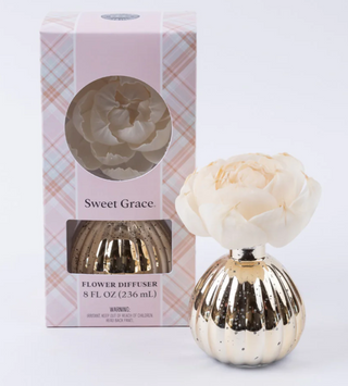 Sweet Grace flower diffuser with gold glass vase and ivory bloom

Holiday Sweet Grace diffuser in metallic gold bottle

Bridgewater Sweet Grace diffuser with boxed gift packaging