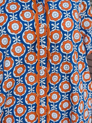 Blue and orange floral scalloped shirt dress with short sleeves and pockets