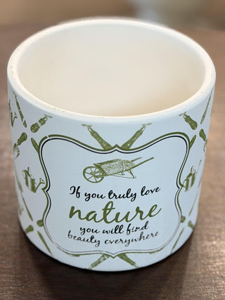 White ceramic garden cachepot with green botanical pattern and inspirational gardening quote, 6-inch decorative planter.
