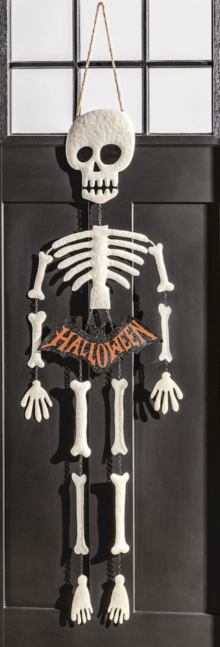 Hand-painted glitter skeleton door hanger with movable metal chain limbs, Halloween banner, and jute hanger for spooky seasonal front door décor.