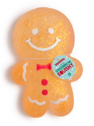 Jumbo Glitter Gingerbread Cookie Squishy with smiling face, red bow tie, and glitter accents.