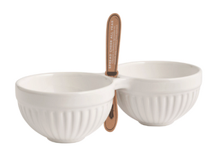 White fluted ceramic double dip bowl with two connected compartments and a center slot designed to hold a spreader.
