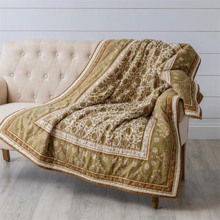 50" x 60" rust block print quilt featuring an intricate floral and botanical pattern in warm earthy tones, perfect for layering on beds, sofas, or accent chairs.