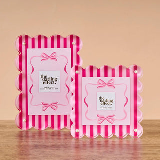 Pink sweetheart stripe acrylic scalloped photo frame with bow detail holding a 4x4 photo

Scalloped acrylic picture frame in pink stripes with magnetized panels for easy photo swapping

Sweetheart stripe acrylic frame for polaroids and 4x6 photos, modern scalloped edge design