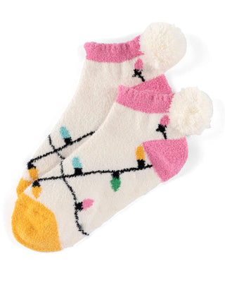 Fuzzy ivory socks with Christmas light pattern and pompom heel

Cozy holiday socks with pink and green lights design

Shiraleah fuzzy ivory home socks with rubber grip bottom

Festive pompom socks with colorful Christmas light print

Soft fuzzy socks in ivory with holiday light design