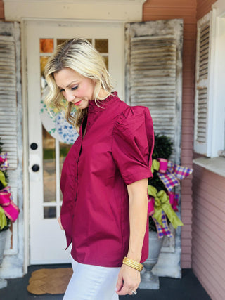 Burgundy puff sleeve blouse with ruffled collar and button-down front
