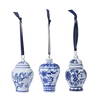 Blue and white porcelain temple jar ornaments with navy hanging ribbons and chinoiserie floral patterns.