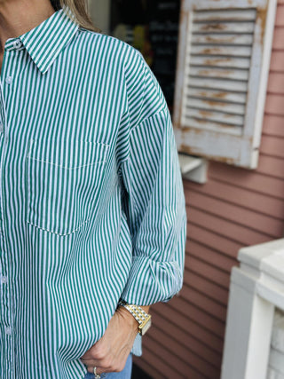 Green and white button-down striped blouse with pocket

Mckenzie striped blouse in green and white vertical stripes

Classic collared blouse with green stripes and long sleeves

Vertical striped button-up blouse with chest pocket