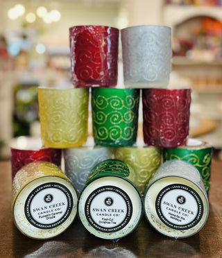 Swan Creek Shimmering Light Large Vase candles in assorted colors

Large soy wax candles in glitter swirl glass jars

Swan Creek 10 oz Shimmering Light candles with decorative glass design

Festive glass candles in red, green, yellow, and white hues

Colorful soy candles in elegant embossed vases by Swan Creek