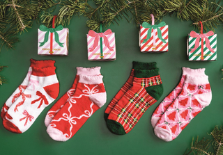 Holiday Socks featuring soft chenille knit fabric, festive Christmas patterns, scalloped cuffs, and ornament-style gift boxes.