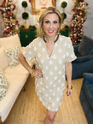 Beige short sleeve dress with textured floral details

Neutral mini dress with white embroidered pattern

Short sleeve beige shift dress with 3D floral accents