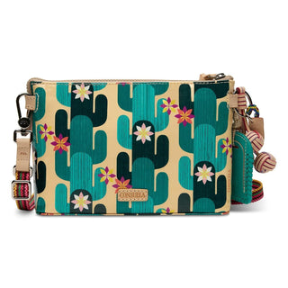 Consuela Dezi Midtown Crossbody with colorful floral embroidery, turquoise pattern, and adjustable woven crossbody strap