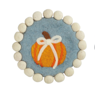 Round felted wool pumpkin topiary trivets with pom-pom trim featuring embroidered pumpkin and pumpkin topiary designs in soft blue, cream, and orange.