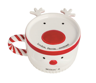 Cookies For Santa Mug Set featuring a ceramic Santa face mug with a candy cane handle and coordinating reindeer cookie plate lid.