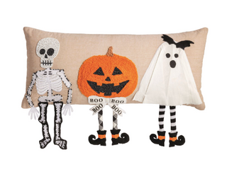 Halloween Dangle Leg Pillow with skeleton, jack-o'-lantern, and ghost appliqués featuring knit dangling legs, bead and bouclé details, and buffalo check backing.