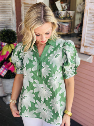 Green puff sleeve blouse with white floral print and v-neckline