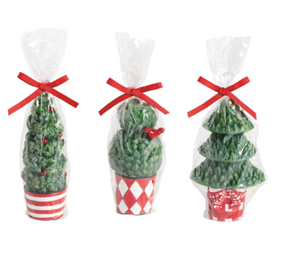 Christmas Topiary Candles featuring hand-painted wax Christmas tree designs in festive decorative pots.