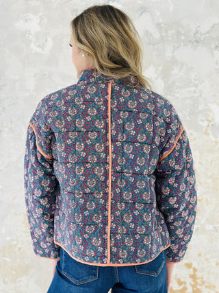 Meadow block print quilted jacket with peach piping and floral pattern

Woman wearing floral cotton quilted jacket with front pockets

Colorful block print jacket with contrast trim and oversized pockets