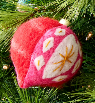 Christmas ornaments with nutcracker and candy cane designs

Handmade felt ornaments with bright candy cane and holiday shapes

Colorful felt Christmas ornaments featuring nutcracker and retro shapes

Festive felt ornaments with candy cane and pink bow details

Whimsical Christmas tree ornaments made from colorful felt
