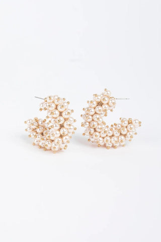 Gold-plated hoop earrings with clusters of faux pearls and gold bead accents

Statement pearl hoop earrings with gold-plated brass posts

Talulah Hoop Earrings featuring faux pearls and gold detailing