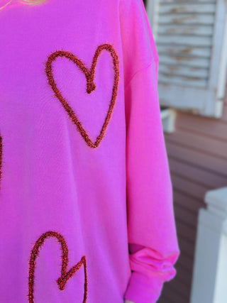 Pink Valentine sweatshirt with sequin heart details

Valentine heart sparkle sweatshirt with tinsel appliqué

Pink cotton blend Valentine sweatshirt with hearts

Women’s Valentine sweatshirt with glitter heart design

Oversized Valentine heart sweatshirt styled casually