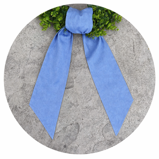 Decorative wreath sash with gingham fabric and scalloped trim close up