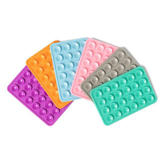 “Blue silicone suction phone mount attached to smartphone”

“Suction cup phone holder in assorted colors”

“Silicone suction phone mount for mirrors and windows”

“Tech suction phone mount display with colorful mounts”

“Phone mount with silicone suction cups and adhesive backing”