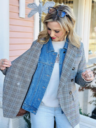 Woman wearing a gray plaid double-breasted blazer with denim shirt insert detail

Darlene Double Blazer in plaid with double-breasted buttons and denim collar detail

Plaid blazer with denim shirt insert, double-breasted front, and long sleeves

Structured plaid blazer layered with built-in denim shirt insert