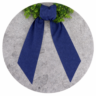 Decorative wreath sash with gingham fabric and scalloped trim close up