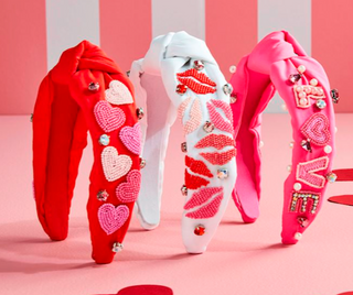 Valentine beaded headband with hearts and rhinestones

Red Valentine headband with hand-beaded heart details

Pink Valentine top-knot headband with rhinestones and beads

White Valentine beaded headband with lip motif

Valentine themed beaded cotton headband with top knot