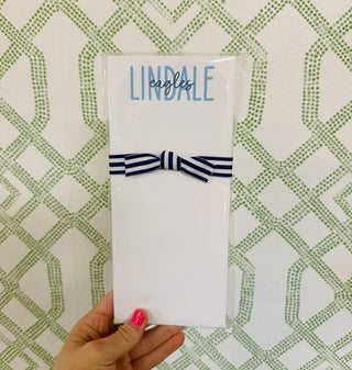 Lindale Eagles Skinnie Notepad with blue school lettering, 50 tear-off sheets, and navy striped ribbon.