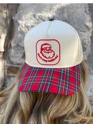 Don’t Stop Believin’ vintage trucker hat with Santa embroidery and plaid brim

Red plaid Christmas trucker hat with embroidered Santa design

Holiday vintage-style hat featuring Santa and Don’t Stop Believin’ text

Cream and red plaid Christmas trucker hat with festive embroidery

Retro Santa trucker hat with plaid bill and cream front panel