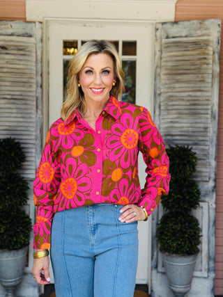 Ivy Jane Daisy Camp Top featuring a bold pink, orange, and brown mod floral print with a button-front design and collared neckline.