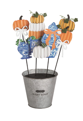 Decorative Pumpkin Topiary Garden Stakes featuring corrugated tin pumpkins, blue chinoiserie accents, and metal stakes displayed in a galvanized bucket.