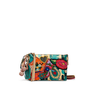 Consuela Dezi Midtown Crossbody with colorful floral embroidery, turquoise pattern, and adjustable woven crossbody strap