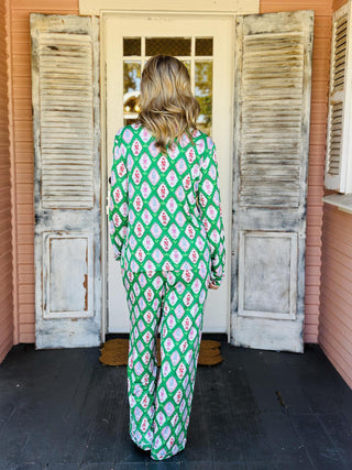 Charlotte Cavalry Christmas Pajama Set with green lattice holiday print

Women’s Christmas pajama set in green, pink, and red Cavalry print

Holiday pajama set with collared button top and drawstring pants

Green festive pajama set with geometric Christmas pattern

Charlotte Cavalry Pajama Set with pockets and classic button top