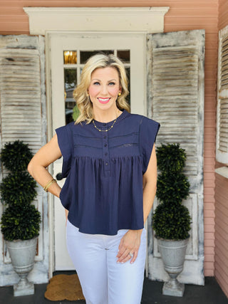 Navy Ramona Top with drop shoulders, lace trim detail, and half button front