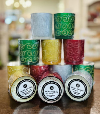 Swan Creek Shimmering Lights Small Vase Candles in assorted colors

Glitter swirl glass candles by Swan Creek in red, green, yellow, and white

Shimmering soy wax candles in colorful glass vases

Small Swan Creek candle collection with decorative swirls

Festive glass vase candles with soy wax by Swan Creek