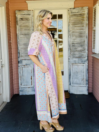 Patchwork print kaftan dress with deep V neckline and short sleeves

Colorful patchwork maxi dress with relaxed kaftan silhouette

Boho patchwork V-neck maxi dress with pockets

Printed kaftan style dress with deep V neckline

Multicolor patchwork maxi dress with flowy fit