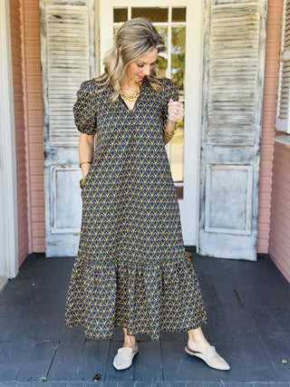 Black floral puff sleeve dress with pink and green print

Mallory Dress in black featuring pink floral pattern and gathered neckline

Black and olive floral long dress with vintage-inspired print