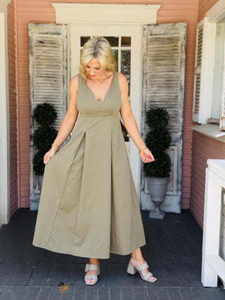 Brown Hallie Rae sleeveless midi dress featuring a relaxed woven silhouette, V-neckline, and side pockets for effortless everyday style.