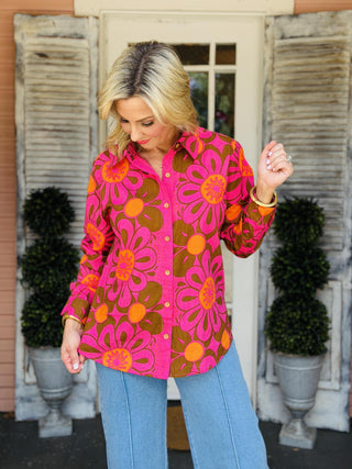Ivy Jane Daisy Camp Top featuring a bold pink, orange, and brown mod floral print with a button-front design and collared neckline.