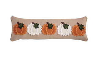 Pumpkin Knit Pillow featuring chunky knit orange and cream pumpkin appliqués with felt leaves on a chambray lumbar pillow with piped edges, 11" x 35".