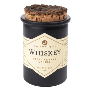 Whiskey Reserve Candle in matte black glass jar with natural cork lid