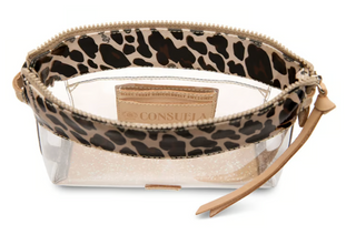 Consuela Mona Clear Midtown Crossbody featuring a transparent body, leopard print trim, natural leather accents, and a colorful woven adjustable crossbody strap.
