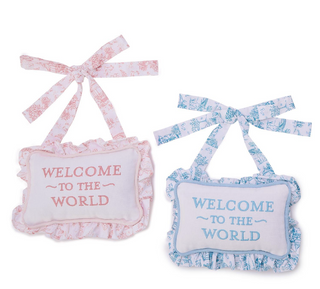 Pink embroidered “Welcome to the World” ruffle pillow door hanger with toile print

Blue “Welcome to the World” embroidered nursery door hanger with ruffle trim

Baby nursery door hanger pillow with embroidered welcome message and toile pattern

Soft cotton “Welcome to the World” pillow door hanger for nursery décor

Embroidered ruffle nursery pillow hanger in pink and blue color options